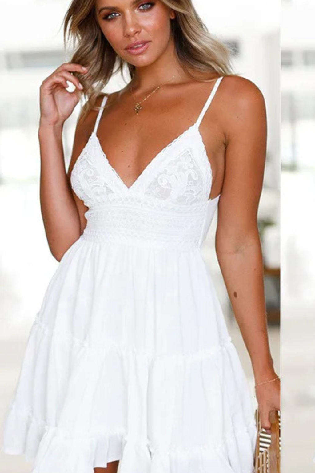 White tiered lace mini sundress for women, with spaghetti straps and a flattering open-back detail for summer style.