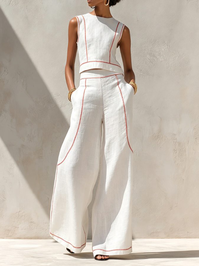 Women's white linen two-piece set featuring a sleeveless top & wide-leg pants. Perfect for chic summer casual wear.