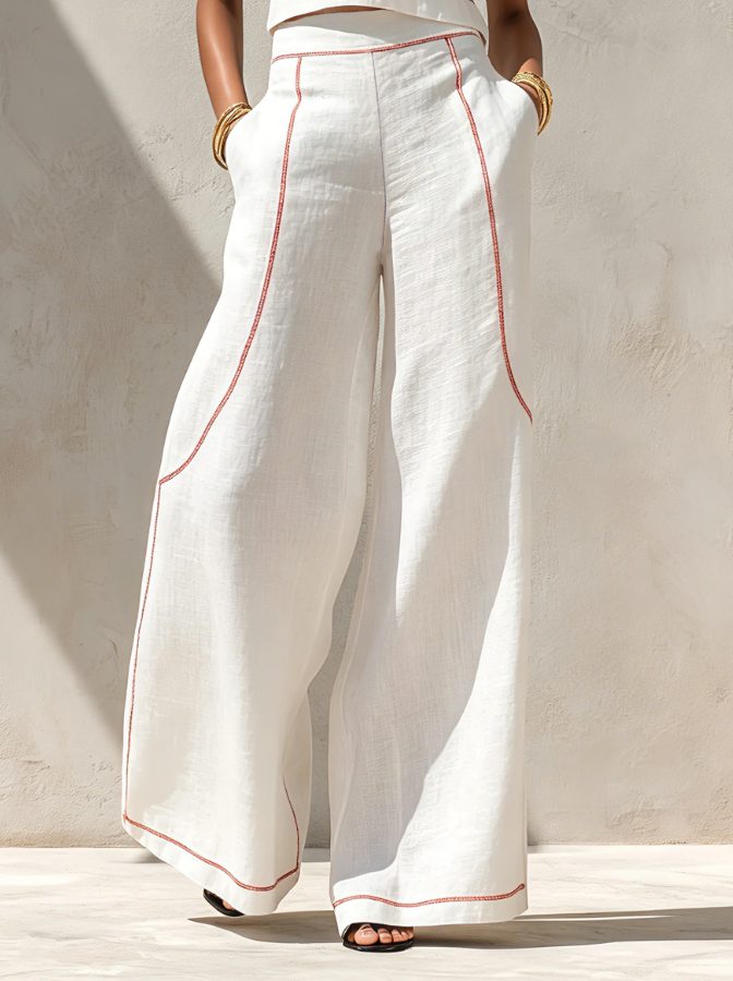 Elegant white linen matching set for women. Features a sleeveless top & flowy wide-leg pants, great for summer fashion.