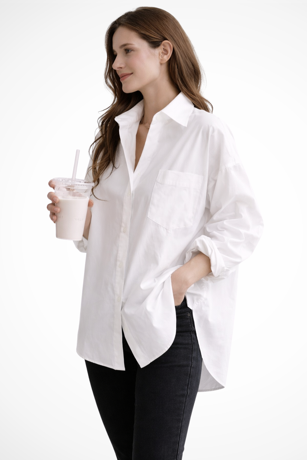 Effortless oversized button down long sleeve blouse for women. White top, relaxed fit, modern casual elegance.