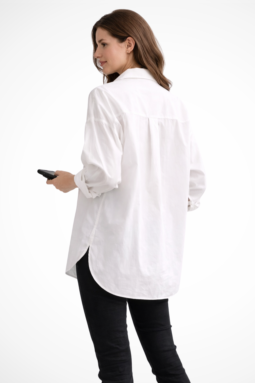 Versatile white oversized button down shirt. Women's long sleeve blouse, relaxed fit, modern wardrobe essential.