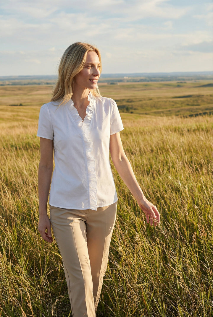 Feminine design: women's ruffled long sleeve shirt in a versatile casual style.