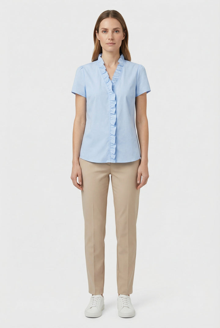 Spring fashion favorite: a women's ruffled long sleeve shirt for effortless style.