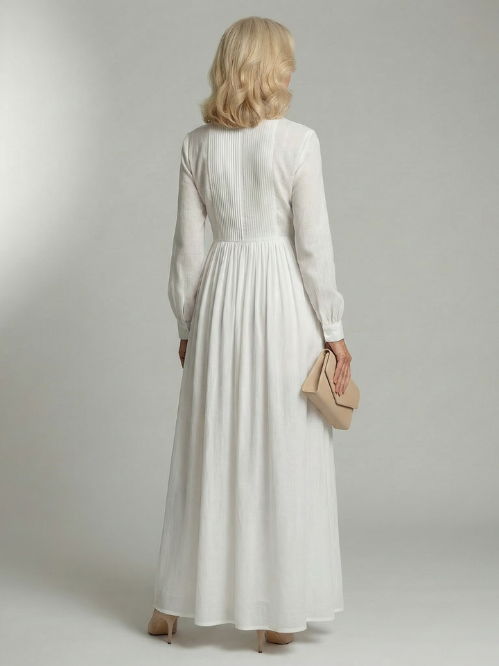 White women's long sleeve maxi dress, button front & flowy style for versatile everyday fashion.