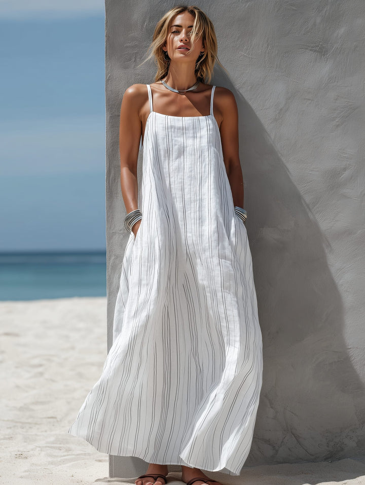 Casual women's striped sleeveless maxi dress in white, featuring a comfortable flowing design for summer.