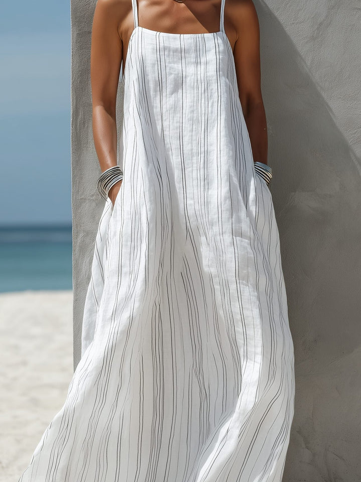 White striped sleeveless maxi dress for women, with a square neck, great for beach wear or a holiday outfit.