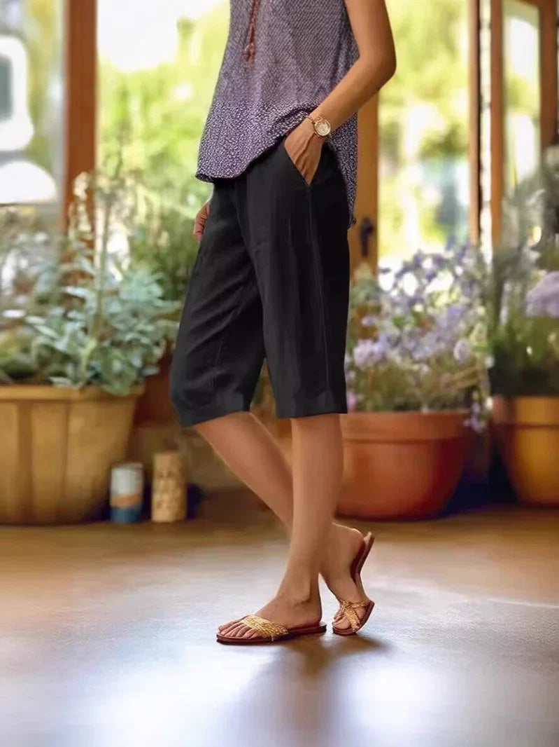 Green women's casual cropped shorts, designed with an elastic waist and convenient pockets for ultimate summer comfort.