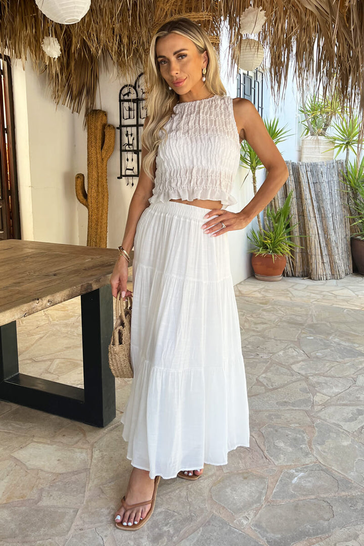 Women's white tiered midi skirt with a high waist and flowy design, perfect for summer casual wear.