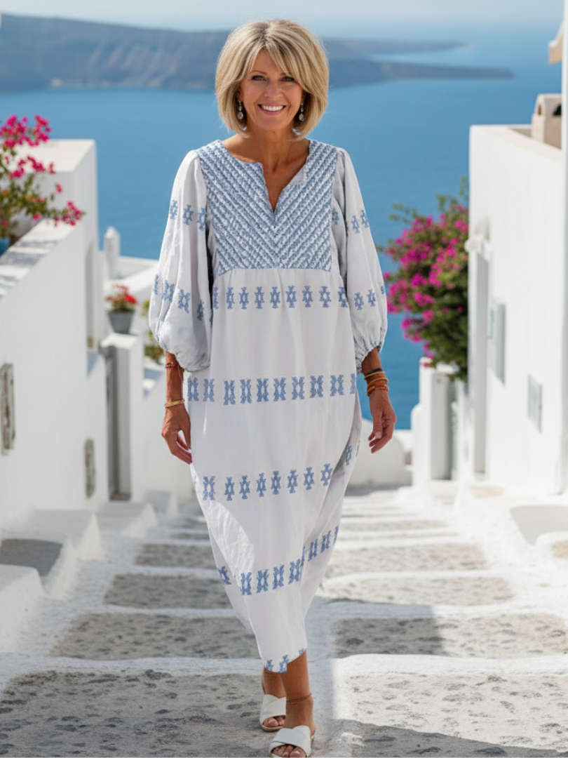 Women's white V-neck long sleeve embroidered maxi dress, relaxed fit, perfect for elegant summer or boho casual wear.