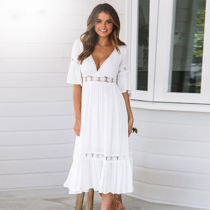 Women's white V-neck tiered midi dress with flutter sleeves, perfect for summer beach or casual wear.