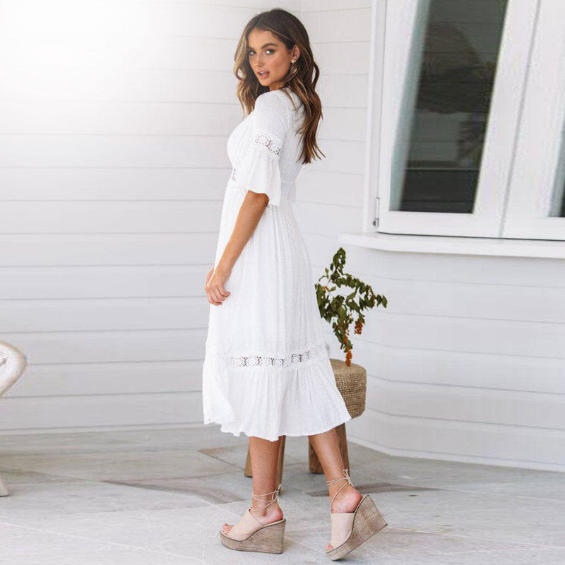 Boho white midi dress for women, featuring a V-neck, tiered skirt, and flutter sleeves, ideal for spring fashion.
