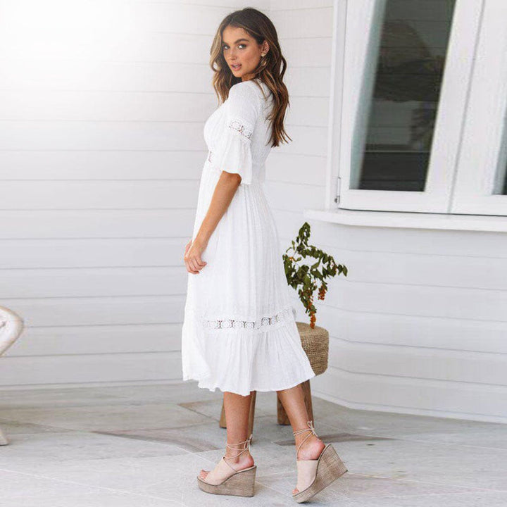Boho white midi dress for women, featuring a V-neck, tiered skirt, and flutter sleeves, ideal for spring fashion.
