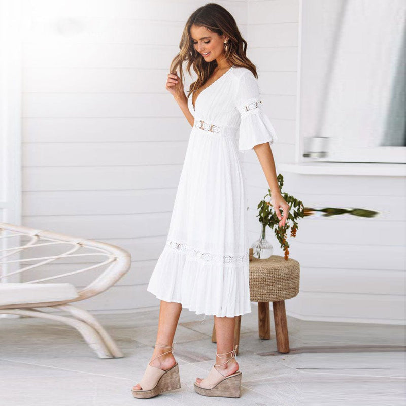 Casual women's white V-neck tiered midi dress with flutter sleeves, a chic summer holiday or beach outfit.