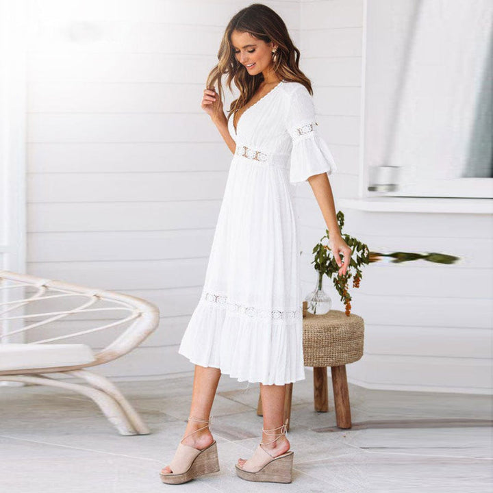 Casual women's white V-neck tiered midi dress with flutter sleeves, a chic summer holiday or beach outfit.