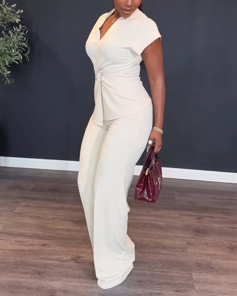 Elegant women's two piece set: V-neck twist front blouse with coordinating straight leg pants