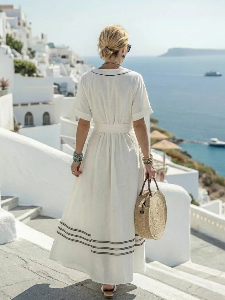 Stylish white wrap midi dress for women, featuring a V-neck and striped short sleeves. Perfect for summer.