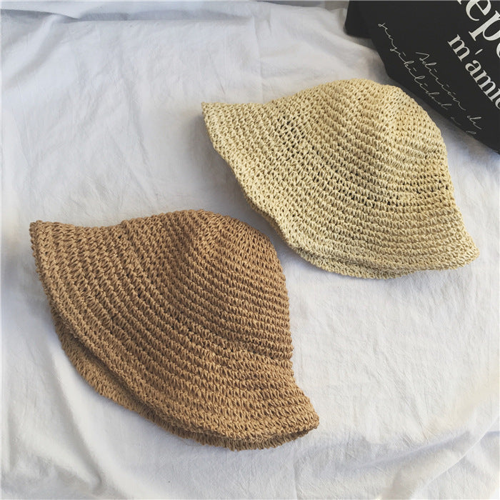 Sun protective women's wide brim crochet straw bucket hat for beach & summer.