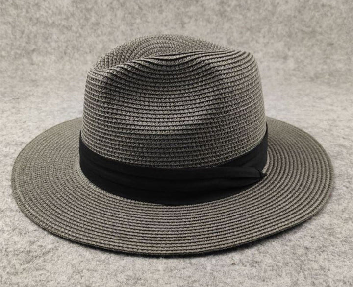 Women's wide brim straw sun hat for beach & summer, perfect vacation accessory.
