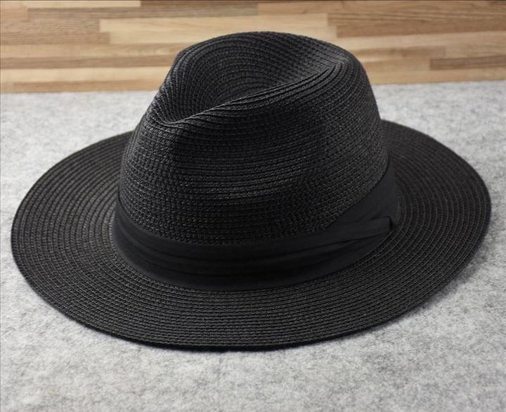Lightweight women's wide brim straw beach hat, perfect summer accessory for sun protection.