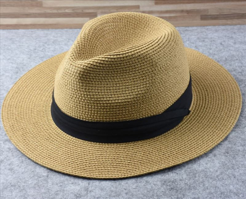 Women's adjustable wide brim straw sun hat, versatile Panama style for beach, garden & summer.