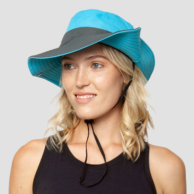Wide-brim UV sun hat for women, with ponytail slot, adjustable & foldable for summer activities.