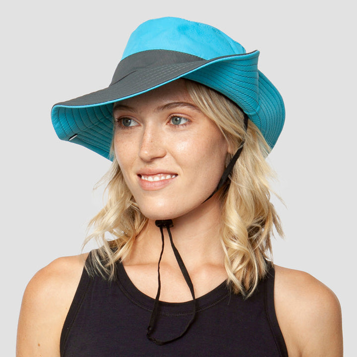 Wide-brim UV sun hat for women, with ponytail slot, adjustable & foldable for summer activities.