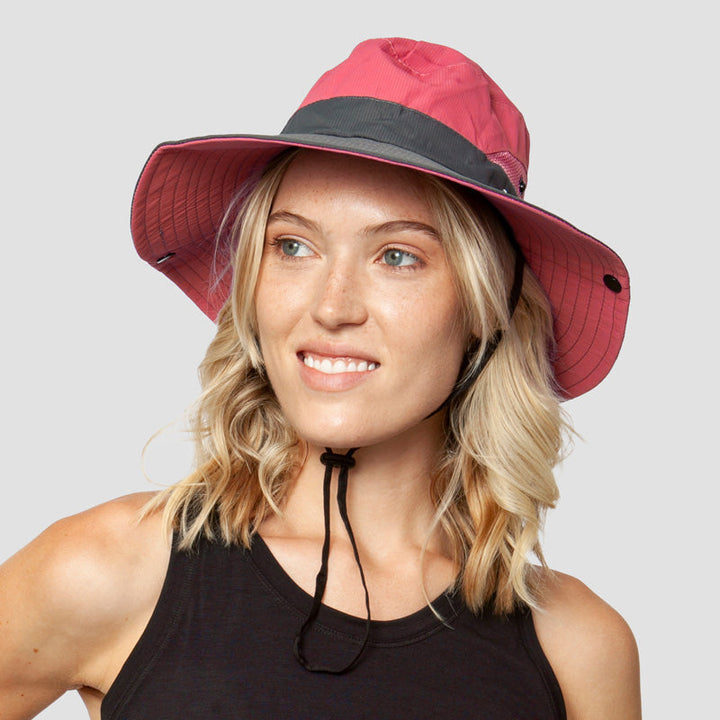 Versatile women's wide-brim sun hat with UV protection & ponytail slot, adjustable for outdoors.