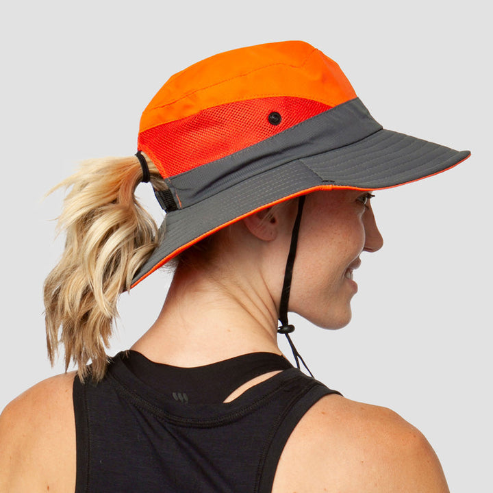 Elegant women's wide-brim sun hat, UV protection, ponytail slot, adjustable & foldable for style.