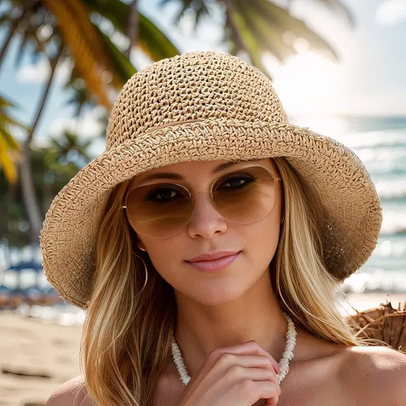 Stylish wide brim woven straw hat for women, ideal for summer beach days, gardens, and outdoor wear.