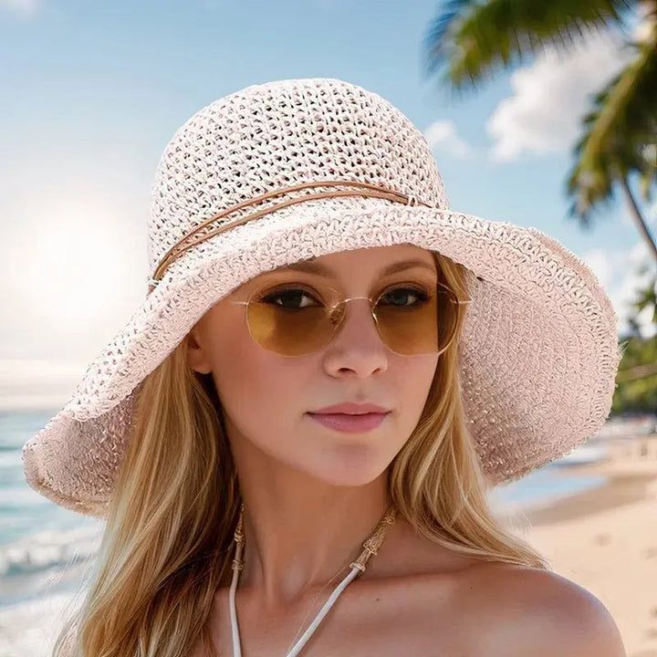 Fashionable women's wide brim straw sun hat, woven for durability and great for beach & garden UV protection.