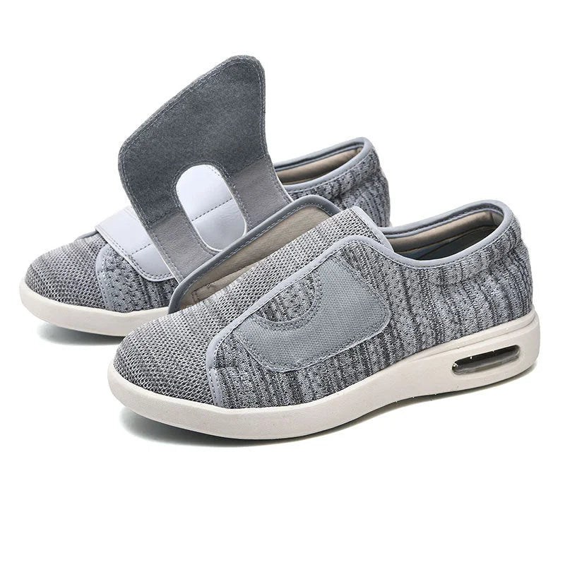 Supportive women's wide fit walking sneakers feature an easy-on Velcro strap and air cushion for ultimate comfort.