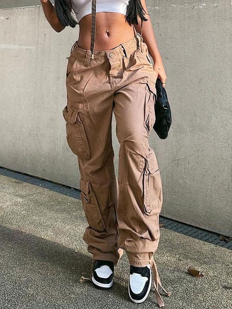 Fashionable women's wide leg cargo pants. Merging utility and streetwear, these pocketed trousers offer urban style.