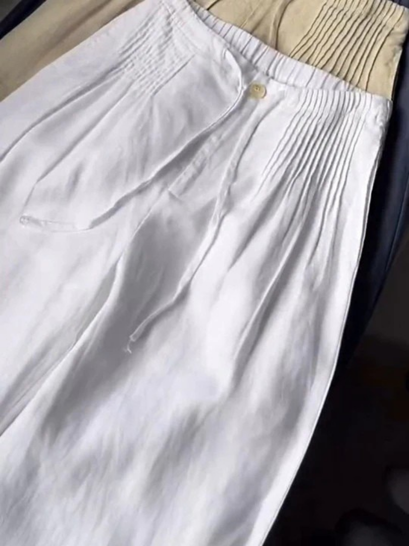 Relaxed fit wide-leg cotton blend trousers for women, offering versatile style for casual or elegant looks.