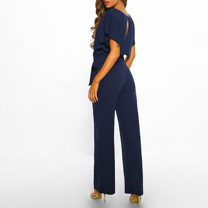 Women's wide leg jumpsuit with belted waist and short sleeves, perfect for effortless spring & summer style.