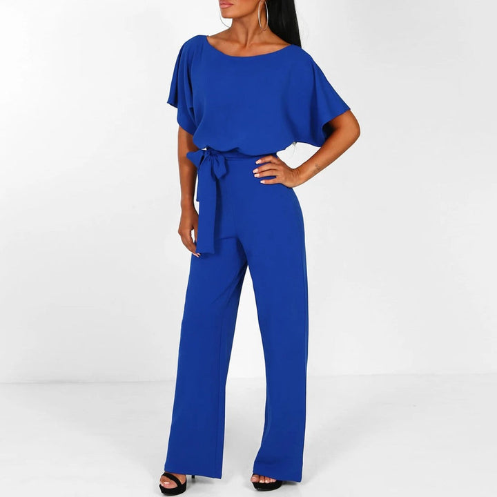 Comfortable wide leg women's jumpsuit, short sleeve & belted, offering a modern, effortless spring look.