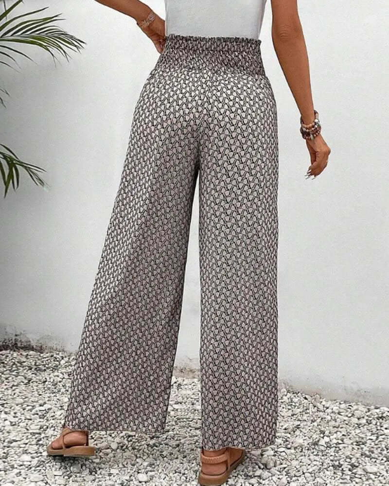 Elegant grey women's wide leg palazzo trousers with a high waist, flowy & lightweight, ideal for vacation.