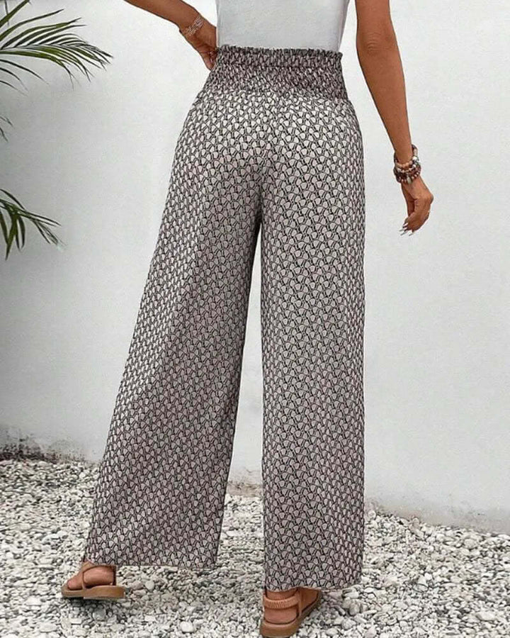 Elegant grey women's wide leg palazzo trousers with a high waist, flowy & lightweight, ideal for vacation.