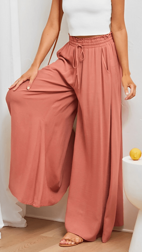 Flowy wide-leg trousers for women, comfortable elastic waist, chic for spring & summer.