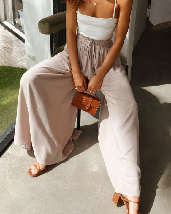 Versatile women's wide-leg trousers with comfortable elastic waist, a must-have stylish bottom.