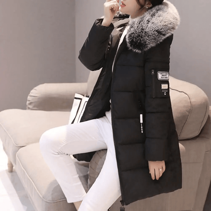 Stay warm & dry in this women's windproof puffer jacket. Hooded winter coat, perfect for cold weather style.
