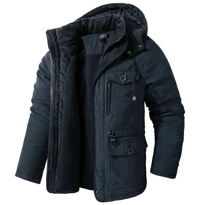 Waterproof women's winter field jacket with a detachable hood. Durable and breathable outerwear for cold weather.