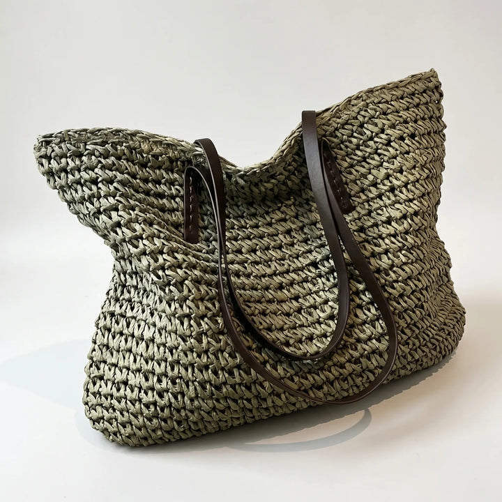 Natural straw woven beach tote bag for women, featuring a chic boho summer design & sturdy straps.
