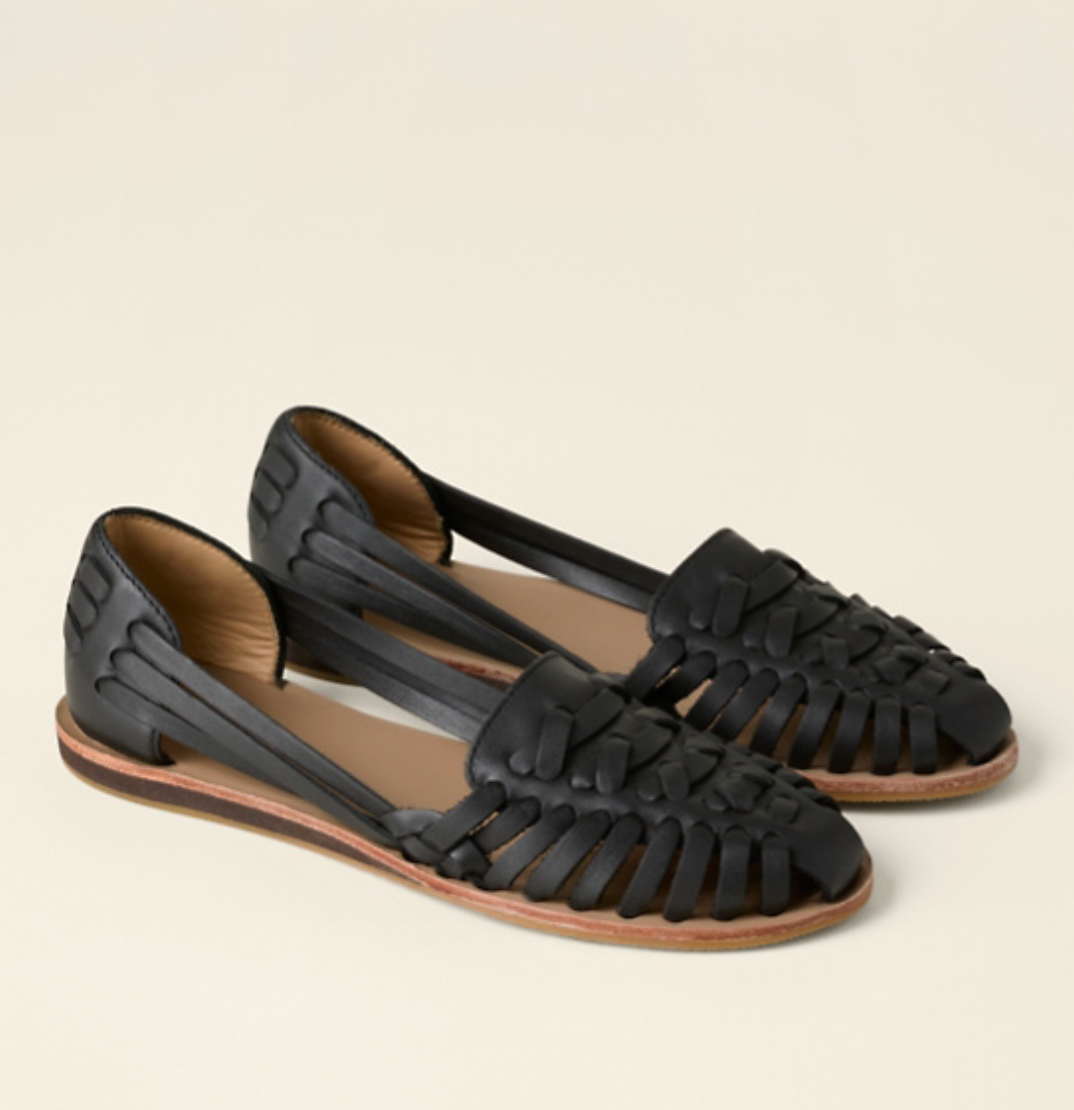 Women's woven closed toe flat sandals in an artisanal style, perfect for comfortable summer everyday wear.