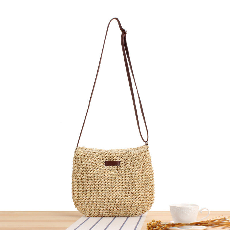 Women's woven shoulder bag with detachable strap, natural material. Stylish crossbody handbag in beige for everyday fashion.