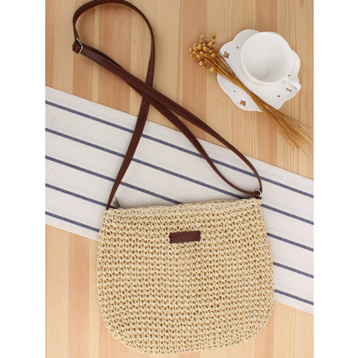 Elegant women's woven shoulder bag in camel, a versatile fashion accessory. Features a removable strap for crossbody wear.
