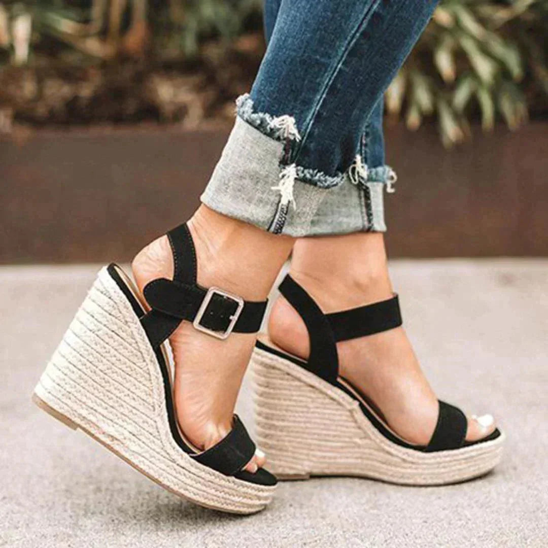Stylish espadrille wedge sandals for women, featuring a comfortable open-toe design and secure ankle strap.