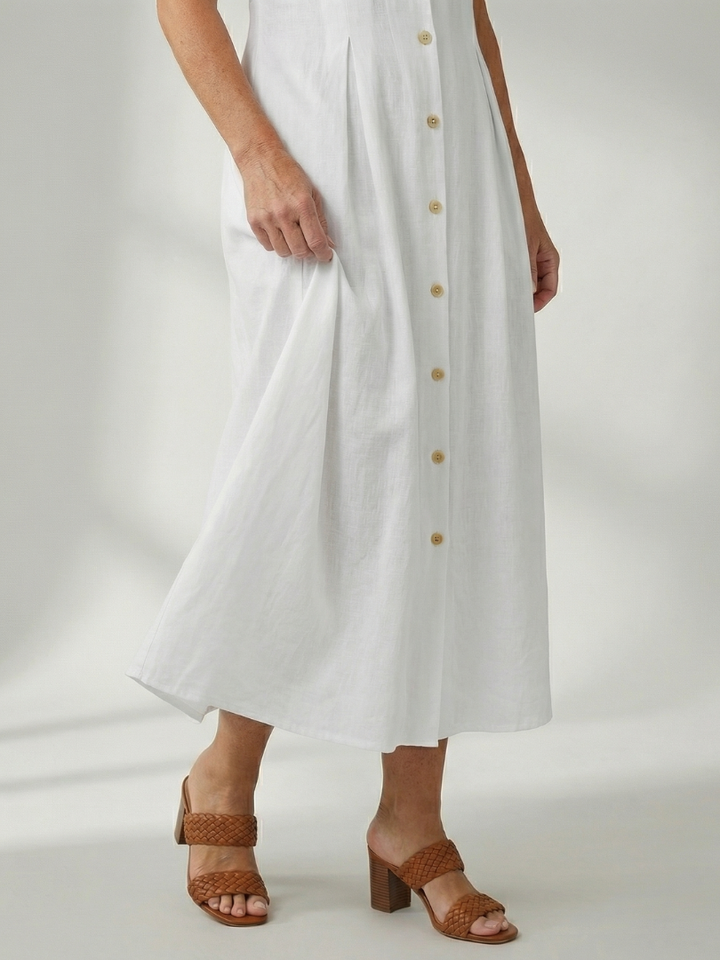 Black stack button midi dress, sleeveless, flattering fit, versatile everyday wear.