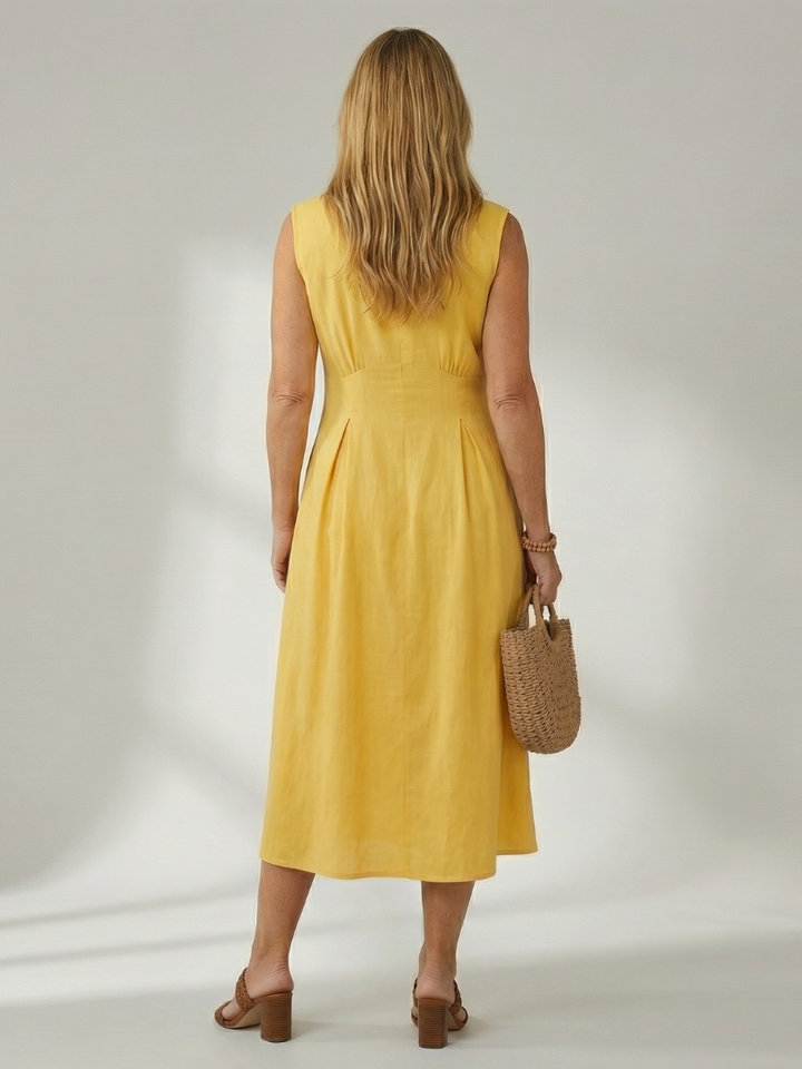 Comfortable white midi dress, stack button detail, ideal for women's casual fashion.