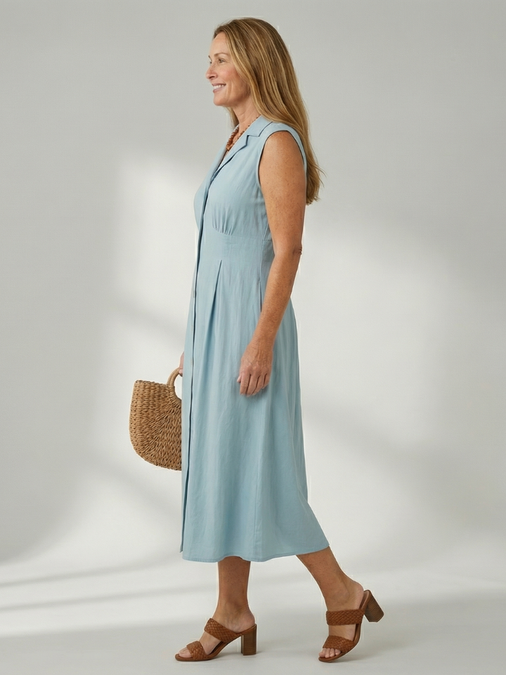 Stylish blue sleeveless midi dress, button-front, perfect for chic summer fashion.