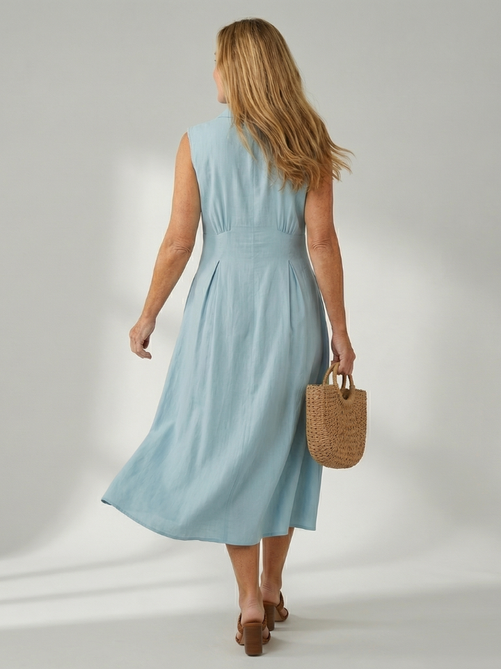 Yellow sleeveless midi dress with stack buttons, effortless summer fashion for women.